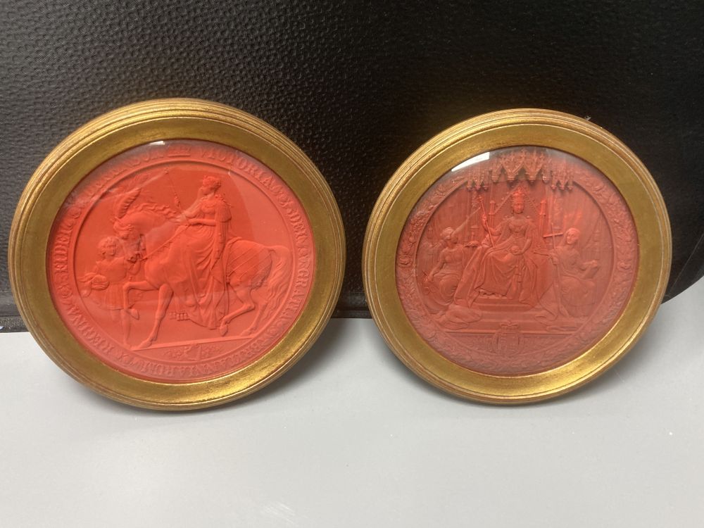 Two mid 19th century Great Seals of Queen Victoria, relief designs in red wax, later framed